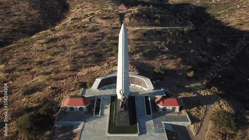 4K aerial drone video of African savanna hills, Heroes Acre memorial complex near B1 highway south of Windhoek in central highland Khomas Hochland of Namibia, southern Africa