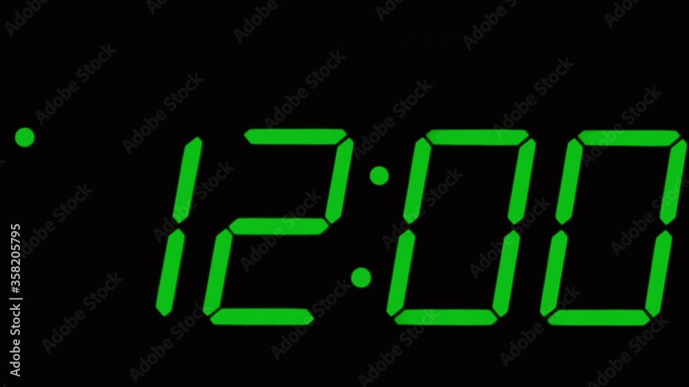 digital clock marking time from 12:00 to 12:59 in green numbers
