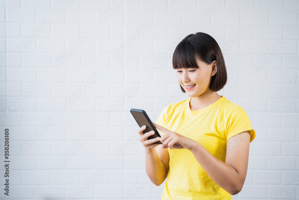 Portrait Asian beautiful girl smiling joyful using mobile phone smart device study at home online class learning student studying lockdown quarantine distance learning educational isolated background Portrait Asian beautiful girl smiling joyful using mobile phone smart device study at home online class learning student studying lockdown quarantine distance learning educational isolated background