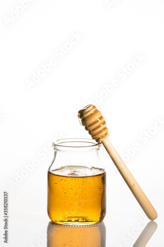 jar of honey and toothpick