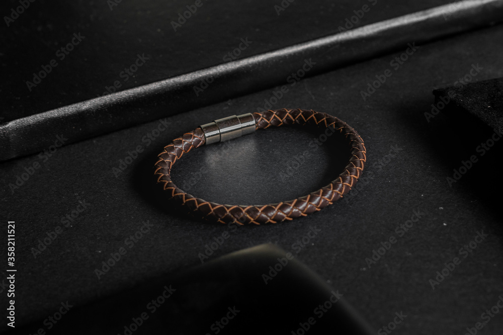 Fototapeta premium leather bracelet on black background