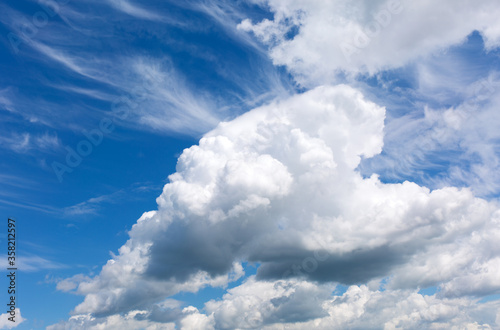 Blue sky background with white clouds.