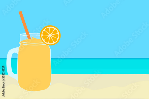 Orange smoothie on the beach