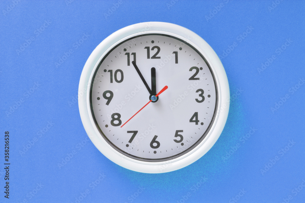 White clock on a blue background White clock on a blue background