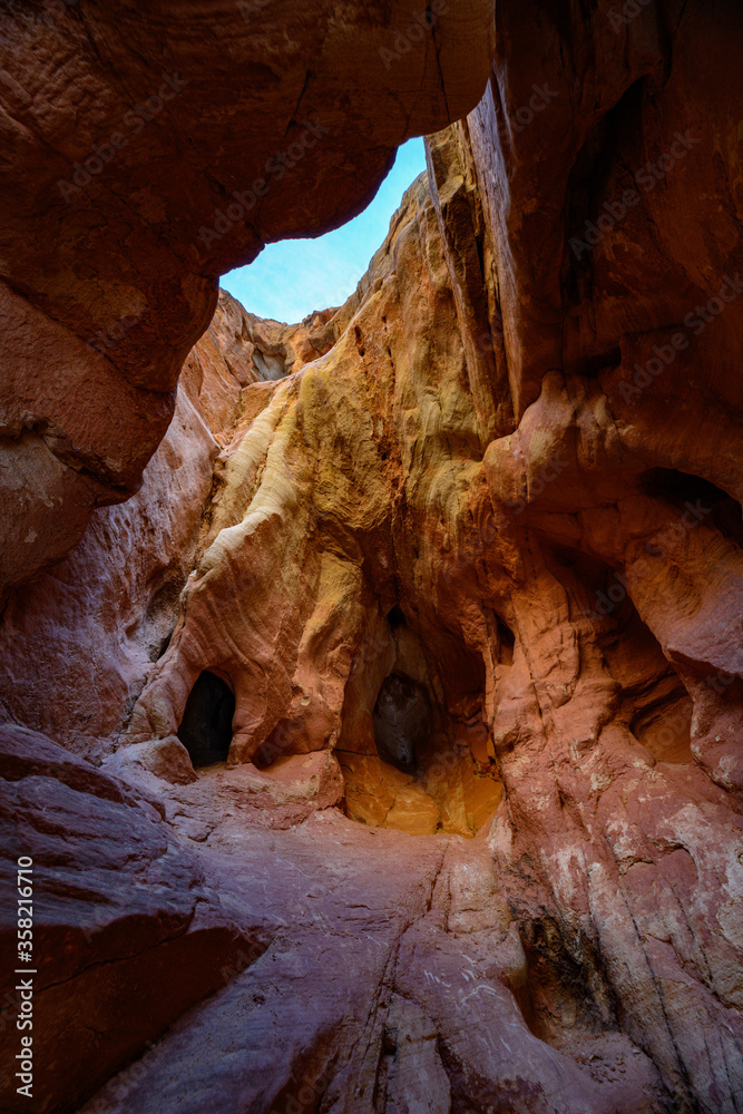 Sun shining through The Narrows covered by snow at Capitol Reef National Park Sun shining through The Narrows covered by snow at Capitol Reef National Park