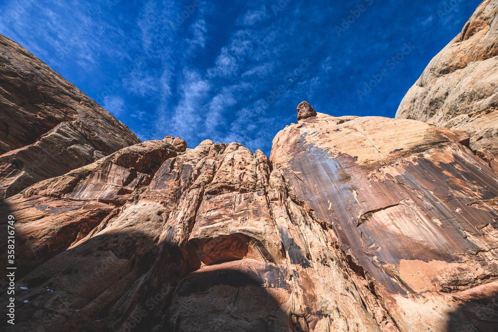 Obraz premium Sun shining through The Narrows covered by snow at Capitol Reef National Park