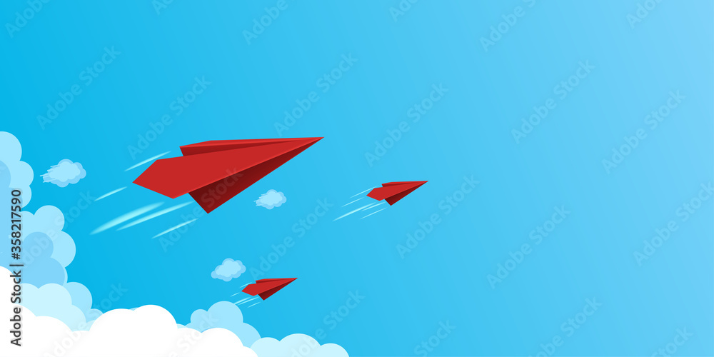Fototapeta premium Red paper airplanes flying on blue sky.Business teamwork and leadership concept.