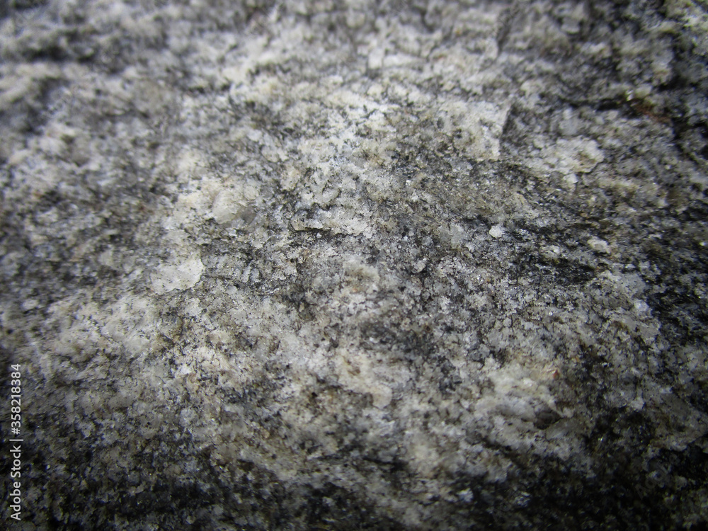 grey rock texture with mica extreme close up