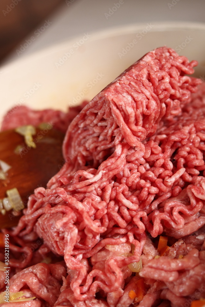 Adding ground meat into frying pan. Making Lasagna Bolognese Series. Adding ground meat into frying pan. Making Lasagna Bolognese Series.