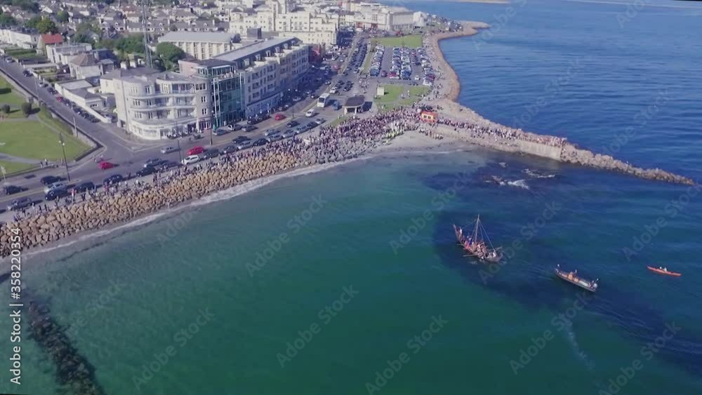 Aerial Top Down Shot of Viking Ship Landing on Salthill Beach, Galway Aerial Top Down Shot of Viking Ship Landing on Salthill Beach, Galway