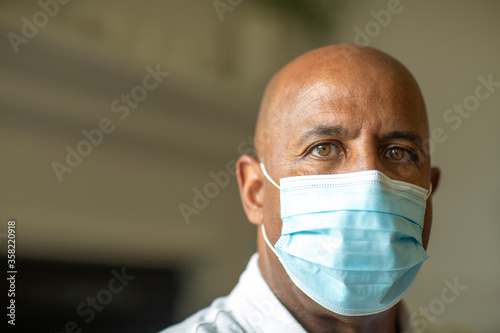 Close up view of an African American man wearing a face mask
