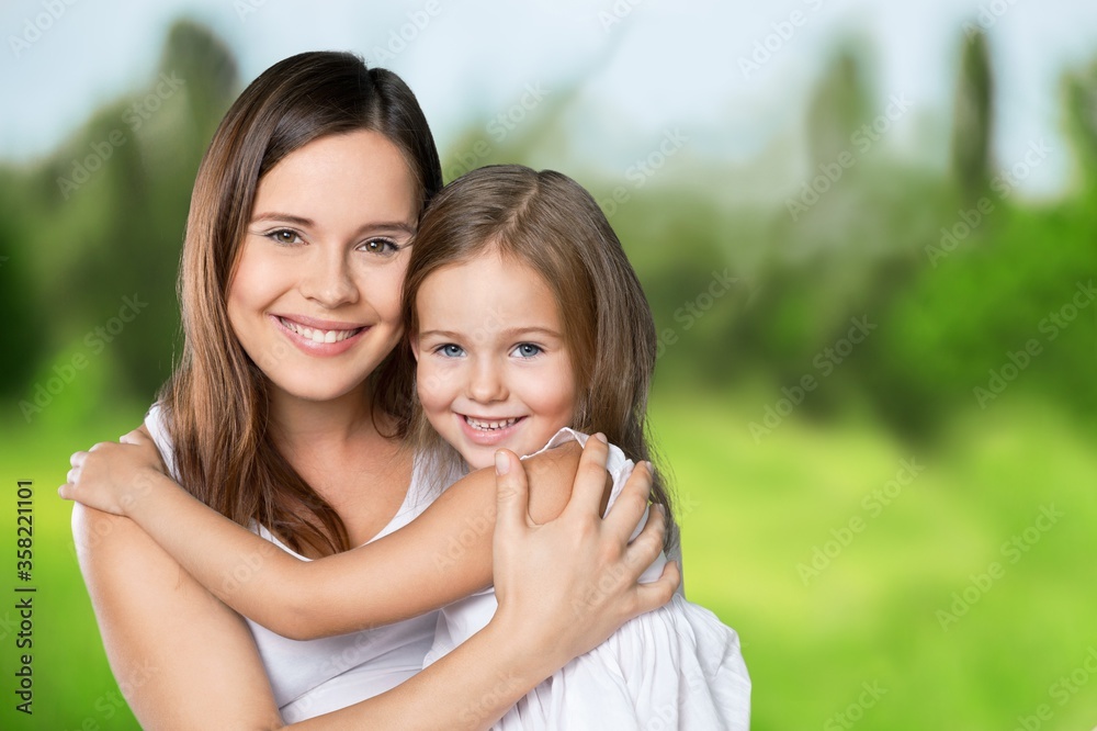 Happy beautiful mother and daughter hugging Happy beautiful mother and daughter hugging