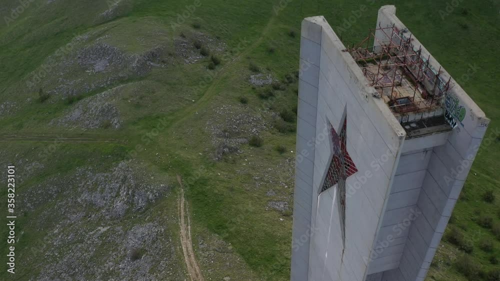Buzludja. Dron top view on one of the largest in Europe abandoned communist monuments in the Balkan mountains, Bulgaria. UFO disc-shaped building with a red star.