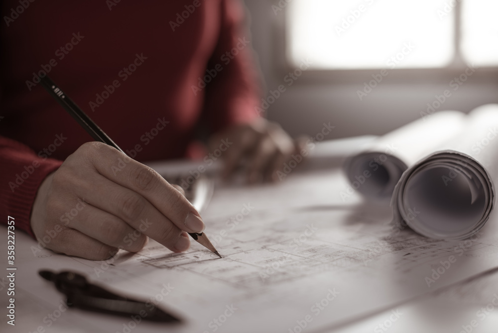 Architect working on blueprint. Architects workplace - architectural ...