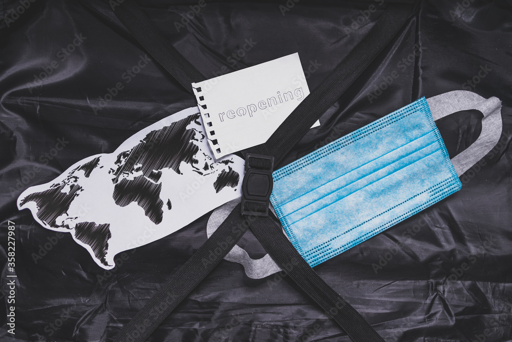 flying during covid19, carryon luggage with surgical face mask for