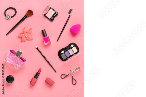 Set of professional decorative cosmetics, makeup tools and accessory of trendy color isolated on white, pink background Flat lay Top view