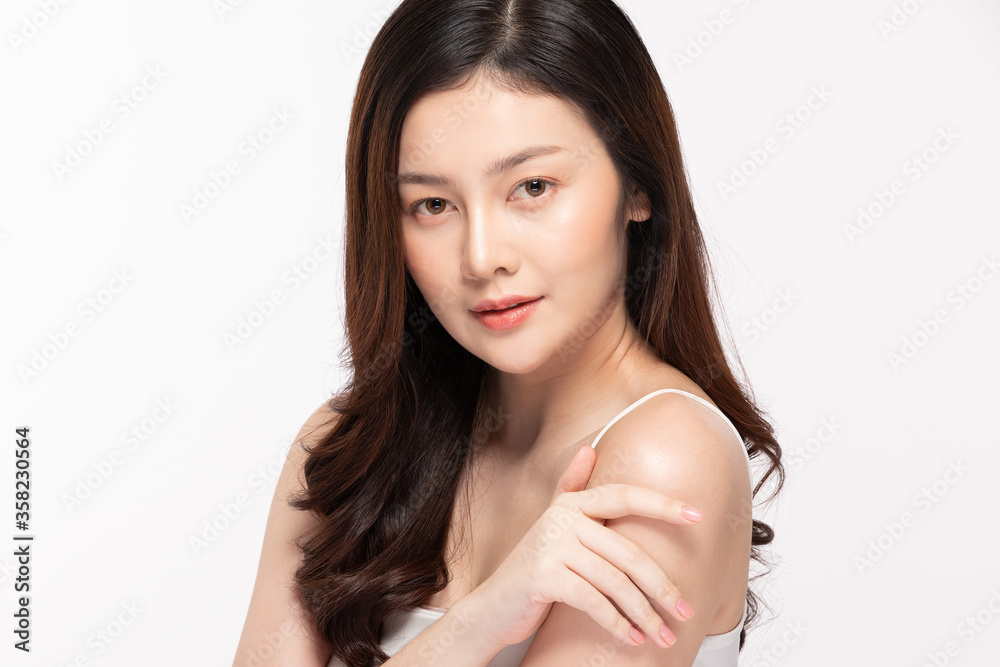 Beautiful Young Asian Woman Looking While Touching Shoulder feeling so happy and cheerful with healthy Clean and Fresh skin,isolated on white background,Beauty Cosmetology Concept Beautiful Young Asian Woman Looking While Touching Shoulder feeling so happy and cheerful with healthy Clean and Fresh skin,isolated on white background,Beauty Cosmetology Concept