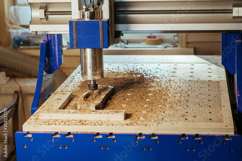 Machine tool in wood factory with drilling cnc machines. Computer numerical control