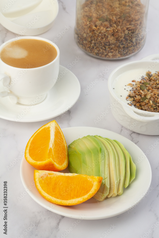 breakfast of coffee, porridge and avocado on a white background. breakfast of coffee, porridge and avocado on a white background.