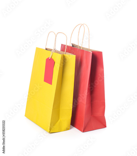 Paper shopping bags on white background