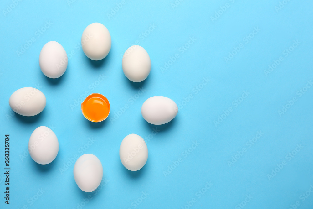 Fresh chicken eggs on color background