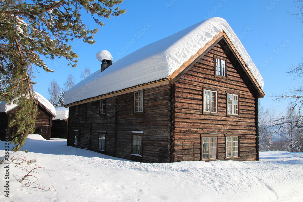 Snow-covered, old wooden log house in Norway Snow-covered, old wooden log house in Norway