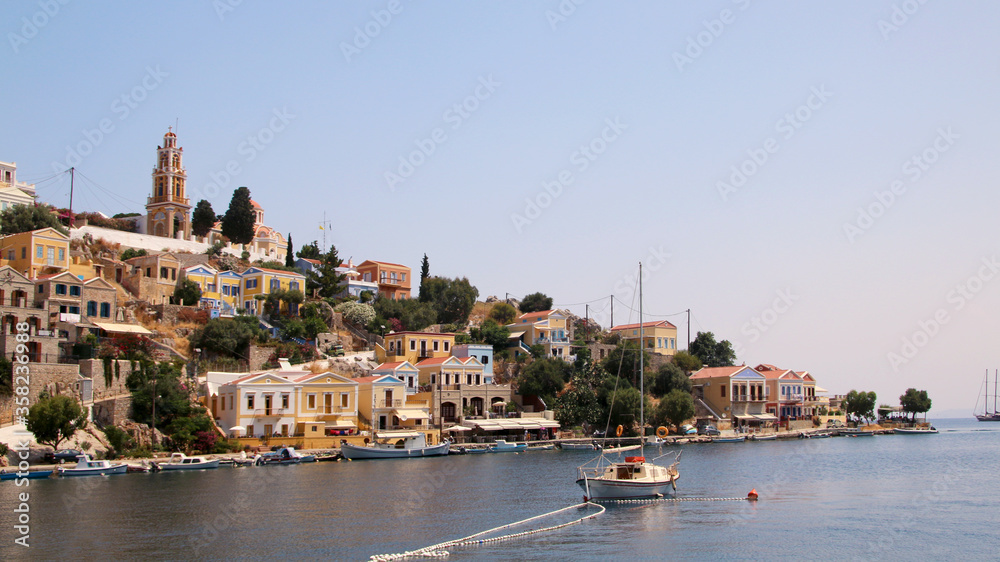 Symi town, Symi island, pictorial view of colorful houses and the harbour