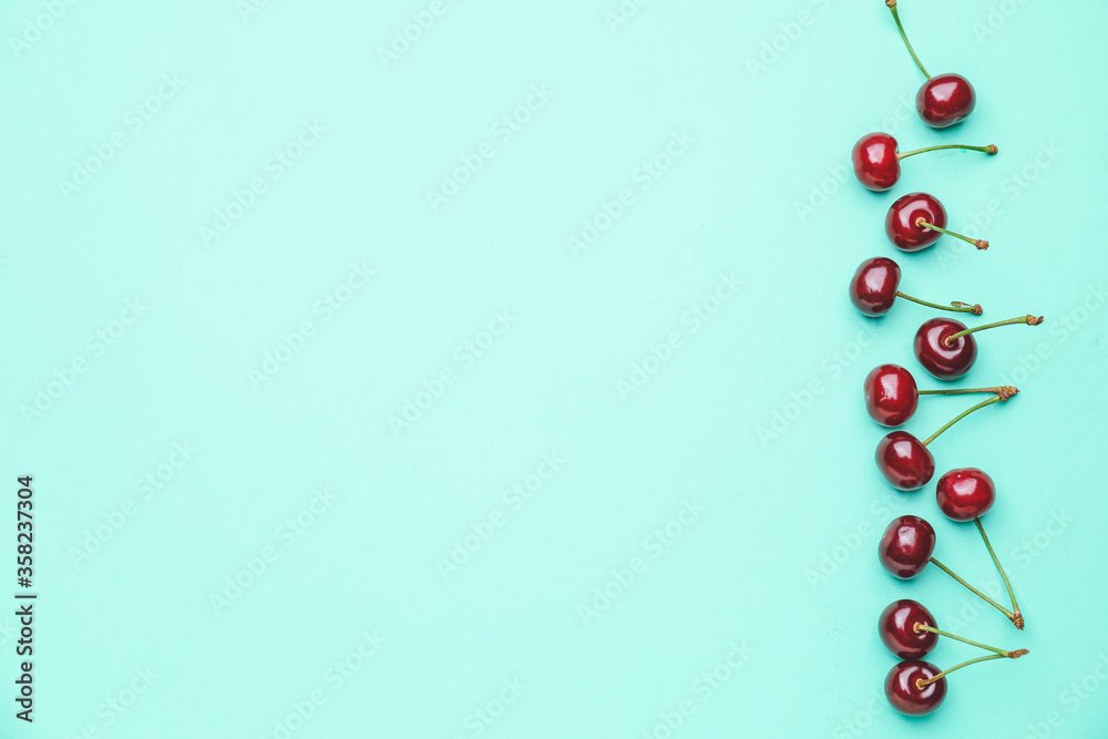 Ripe sweet cherry on color background Ripe sweet cherry on color background