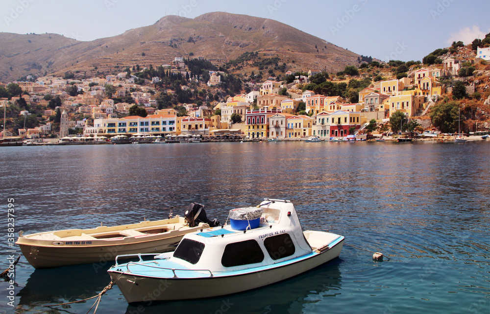 Fishing boats in the port of Symi town, Symi island, Greece