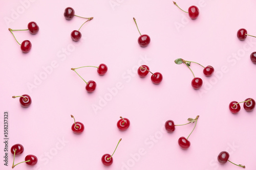 Ripe sweet cherry on color background