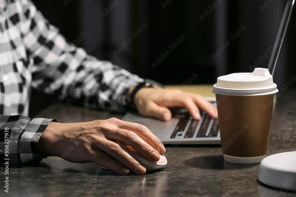 Woman using PC mouse while working on computer at table, closeup Woman using PC mouse while working on computer at table, closeup