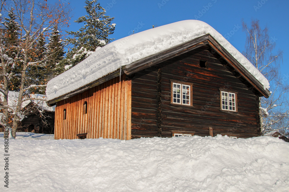 Old snow-covered Viking wooden house in Norway, Gjøvik