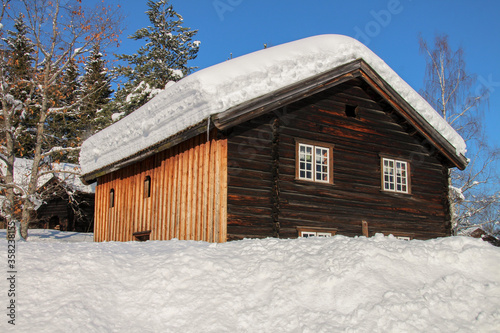 Old snow-covered Viking wooden house in Norway, Gjøvik © Barnabas