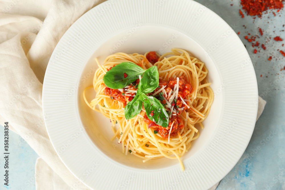 Plate with tasty pasta bolognese on table