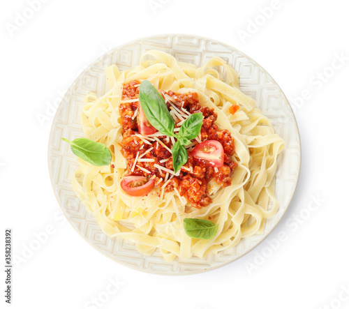 Plate with tasty pasta bolognese on white background