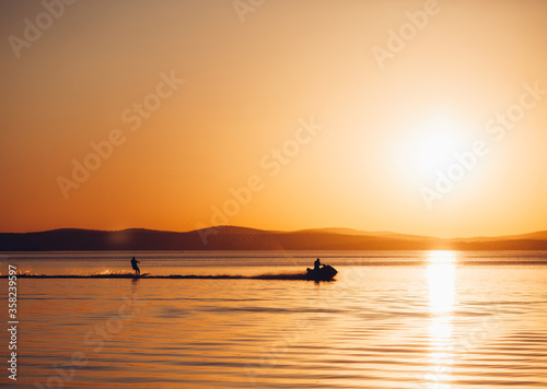 silhouette of a man on a boat