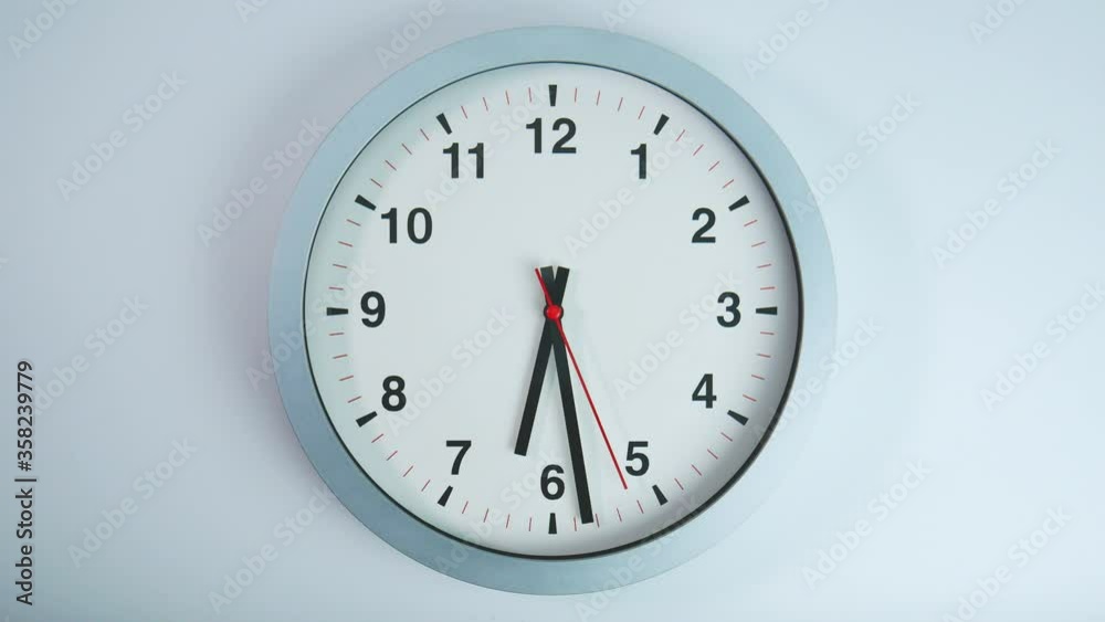Gray wall clock isolated on white background. Gray wall clock isolated on white background.