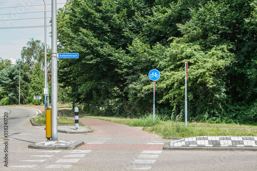 bicyclepath crossing with road for cars photo