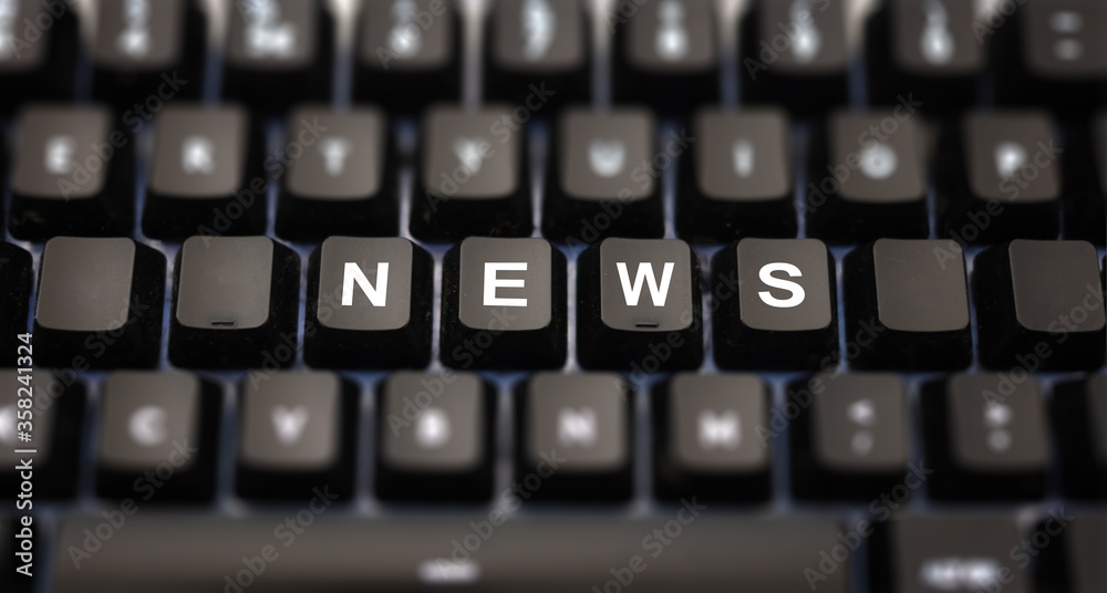 Online news, journalism concept. News text written on keypad. Black keys with white letters message for press articles on pc keyboard. Blur buttons background. Online news, journalism concept. News text written on keypad. Black keys with white letters message for press articles on pc keyboard. Blur buttons background.