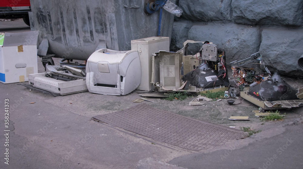 Discarded computer equipment in a landfill. Printers monitors and computers. Environmental pollution. Stock photo background Discarded computer equipment in a landfill. Printers monitors and computers. Environmental pollution. Stock photo background