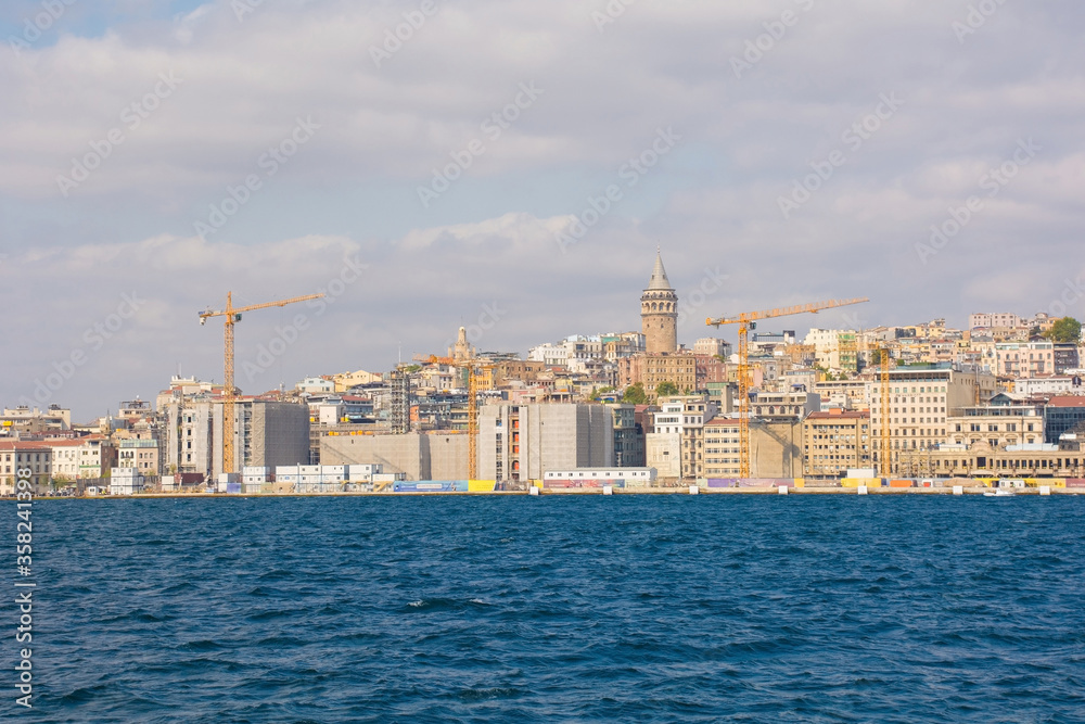 The Bosphorus waterfront of the Karakoy district in Beyoglu on the Europen shore of Istanbul. In the centre is Galata Tower
