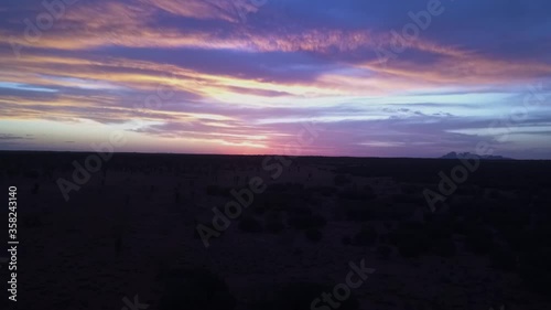 Amazing outback aerial sunset with Kata Tjuta / The Olgas in the distance photo