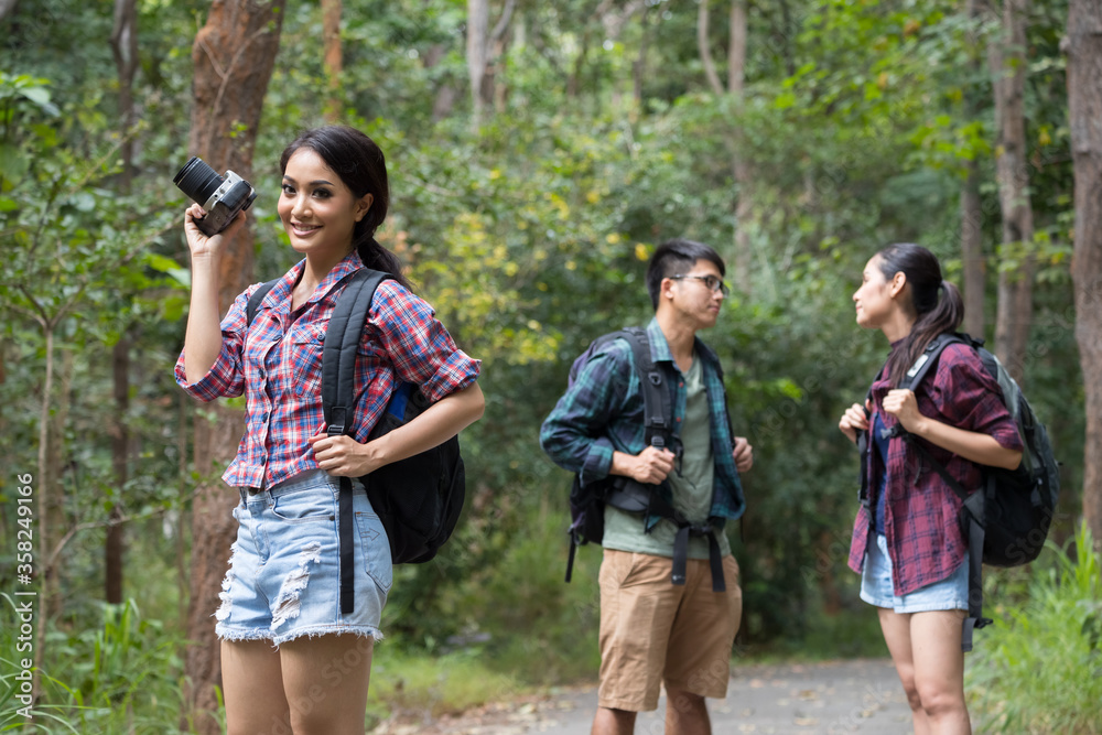 Teens asian travel with backpack a relax in the forest, Concept Travel