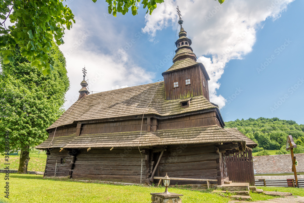 View at the Wooden Church of Saint Michael Archangel in village Topola, Slovakia View at the Wooden Church of Saint Michael Archangel in village Topola, Slovakia