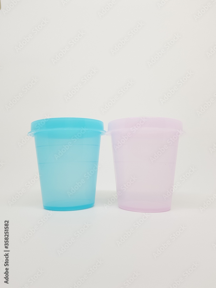 colorful plastic container over white background colorful plastic container over white background