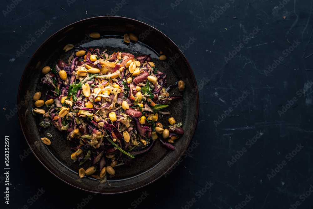 Tasty lunch with red cabbage, peanuts, beans and various vegetables, top view, copy space. Tasty lunch with red cabbage, peanuts, beans and various vegetables, top view, copy space.