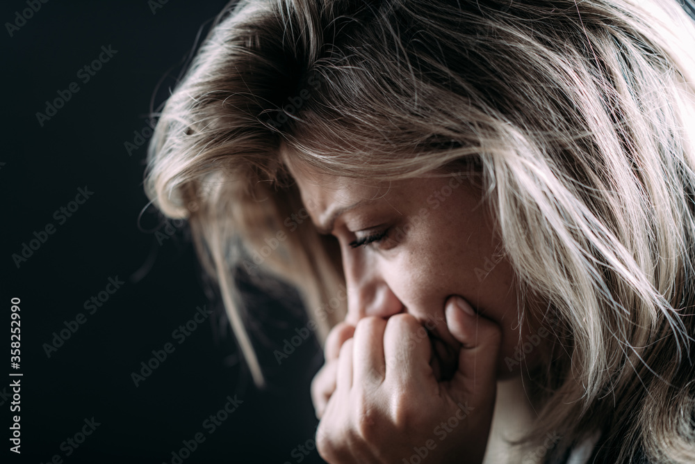 Fototapeta premium Anxious Female suffering from PTSD after Covid19 isolation lockdown.