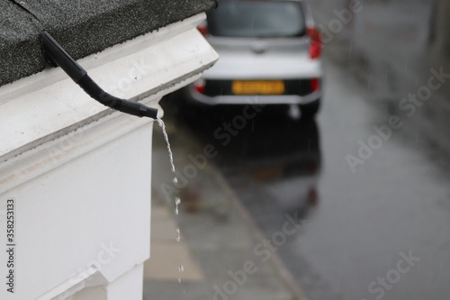rain pipe and car