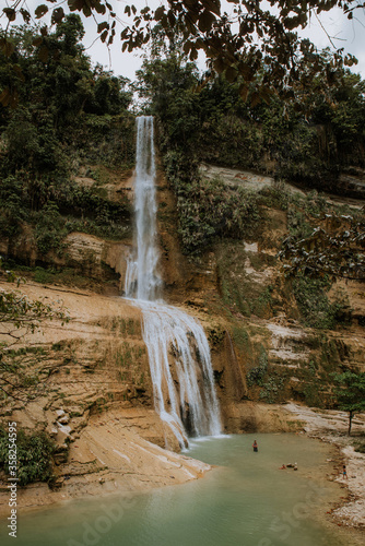 nature stamp with a beautiful waterfall on the island of bohol in the philippines