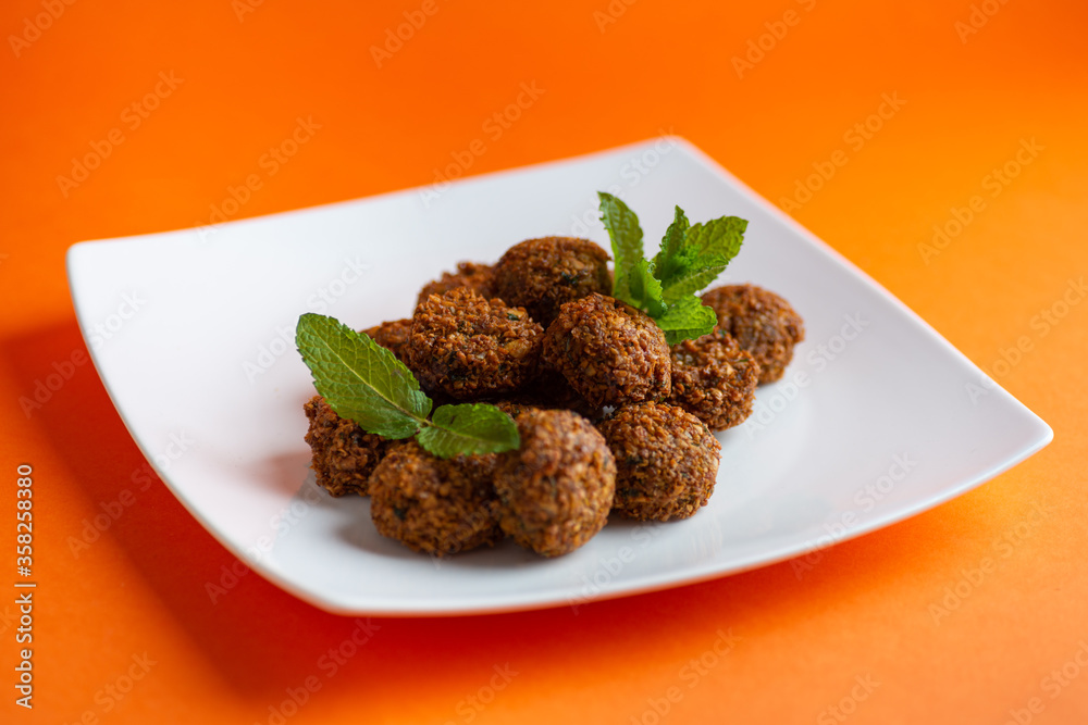 Falafel , middle eastern deep fried chickpea balls with french fries Falafel , middle eastern deep fried chickpea balls with french fries